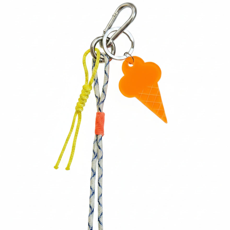 White nautical rope bag charm with yellow cord and orange ice cream pendant – product view
