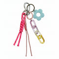 Pink nautical rope bag charm with acrylic chain and blue flower pendant – product view
