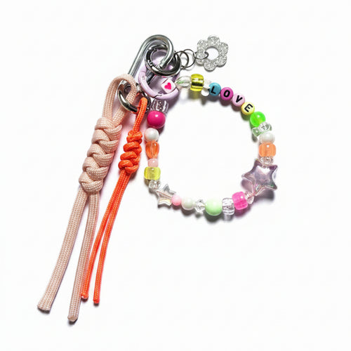 Peach and orange nautical rope bag charm with colorful beaded "Love" loop and silver flower pendant – product view