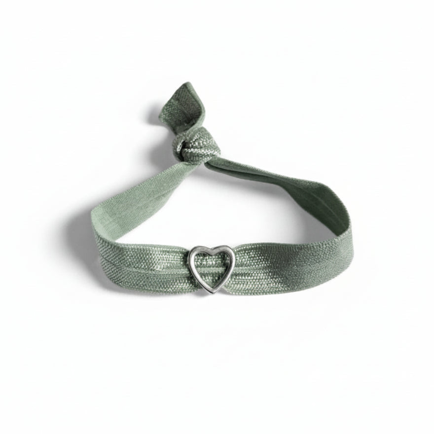 Green elastic bracelet with silver heart charm – product view