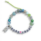 Handmade Eras Tour friendship bracelet with letter beads, heart bead and teddy bear charm – product view