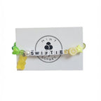Multicolour beaded "Swiftie" friendship bracelet with gummy bear charm on Mint Sorbet packaging card