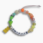 Multicolour beaded "Swiftie" friendship bracelet with yellow gummy bear charm – product view