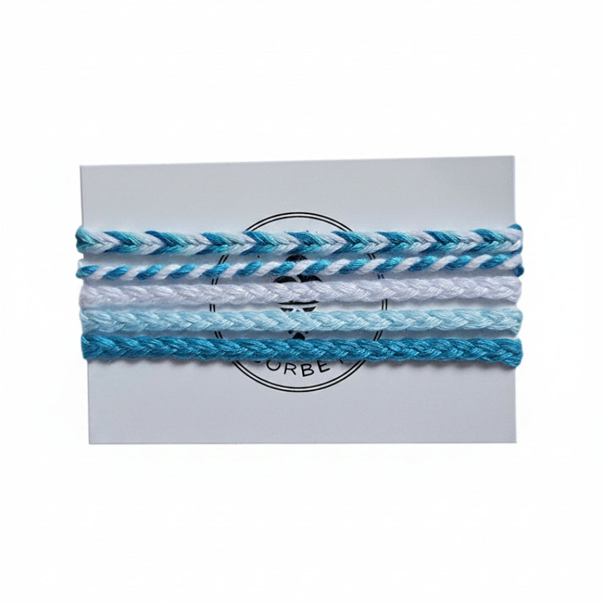 Blue, white and light blue hand-knotted cotton friendship bracelet set of 5 on Mint Sorbet packaging card