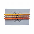 Yellow, orange, green and white hand-knotted cotton friendship bracelet set of 3 on Mint Sorbet packaging card