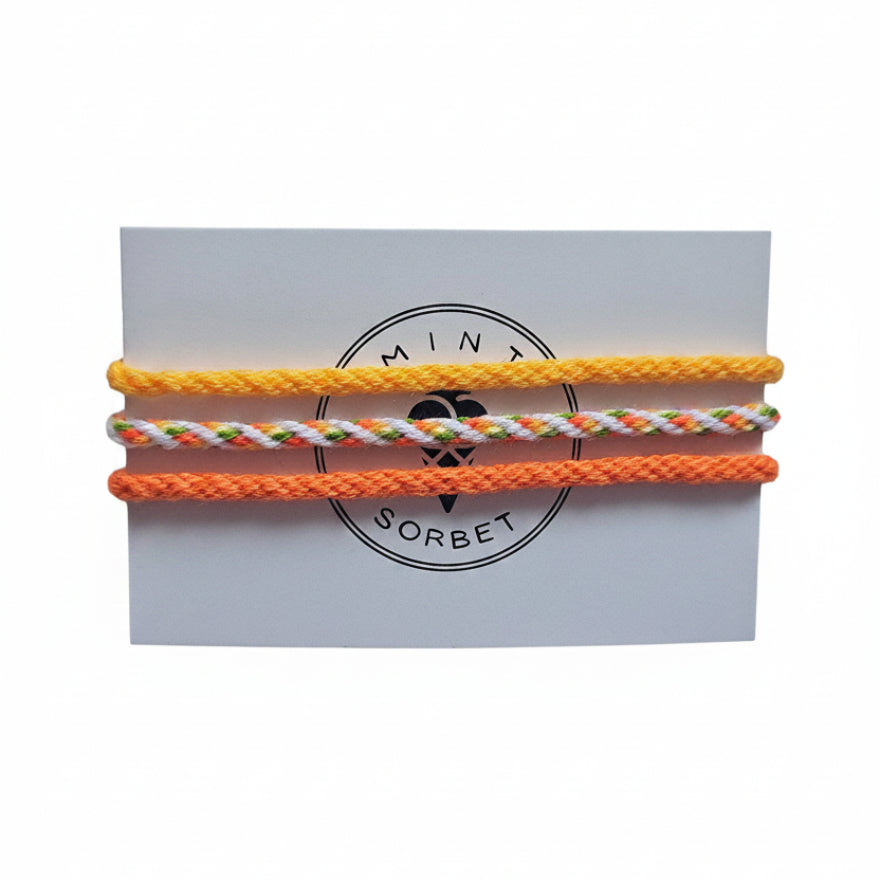 Yellow, orange, green and white hand-knotted cotton friendship bracelet set of 3 on Mint Sorbet packaging card