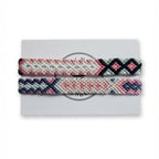 Pink, black and sage green hand-knotted cotton friendship bracelet set of 2 with diamond pattern on Mint Sorbet packaging card