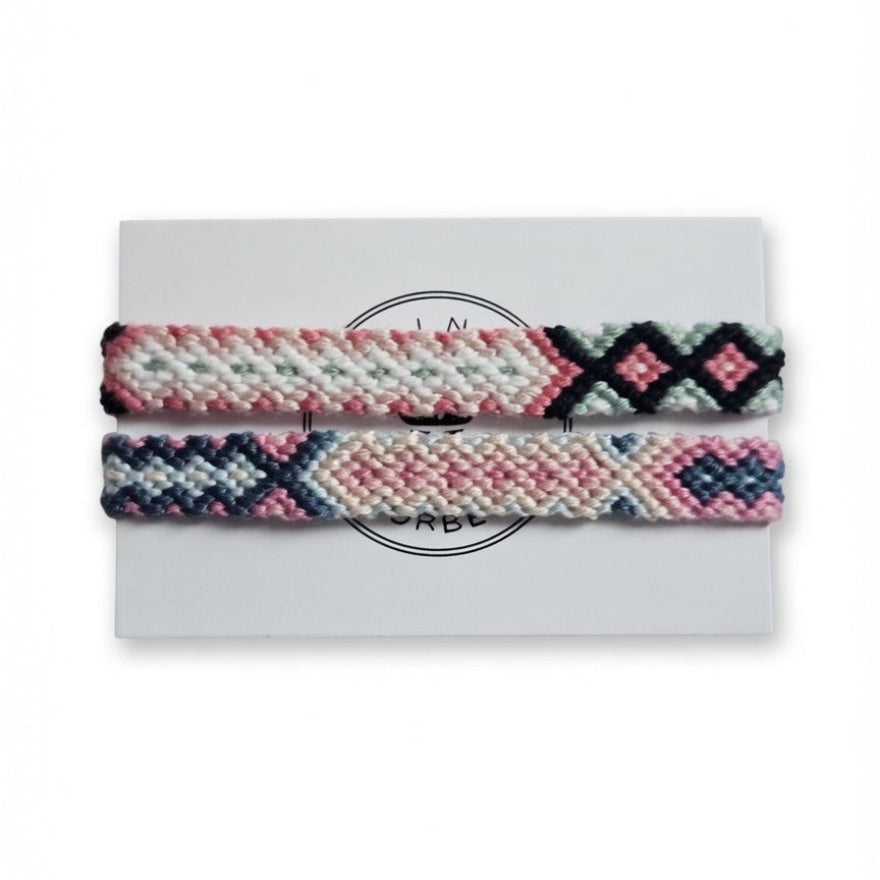 Pink, black and sage green hand-knotted cotton friendship bracelet set of 2 with diamond pattern on Mint Sorbet packaging card