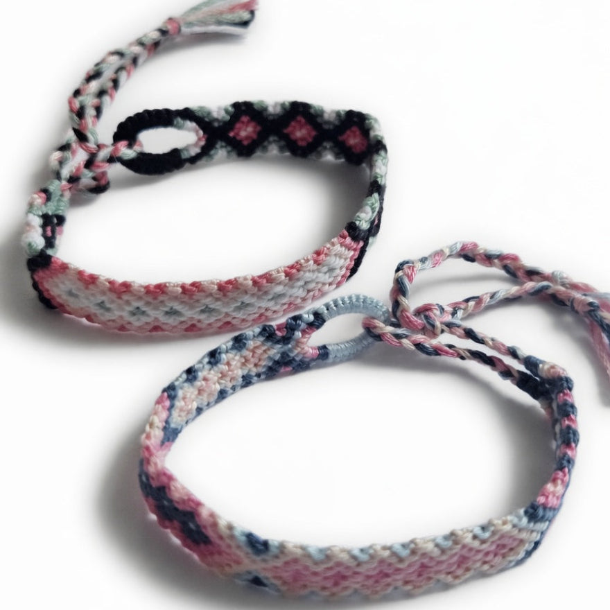 Pink, black and sage green hand-knotted cotton friendship bracelet set of 2 with diamond pattern – product view