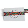 Hand-knotted multicolor cotton friendship bracelet with chevron pattern on Mint Sorbet packaging card