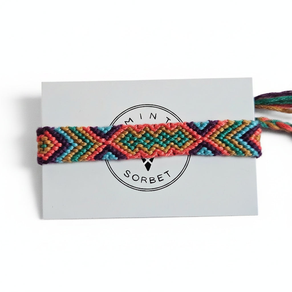 Hand-knotted multicolor cotton friendship bracelet with chevron pattern on Mint Sorbet packaging card