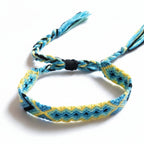 Hand-knotted blue and yellow cotton friendship bracelet with diamond pattern – product view