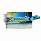 Hand-knotted blue and yellow cotton friendship bracelet with diamond pattern