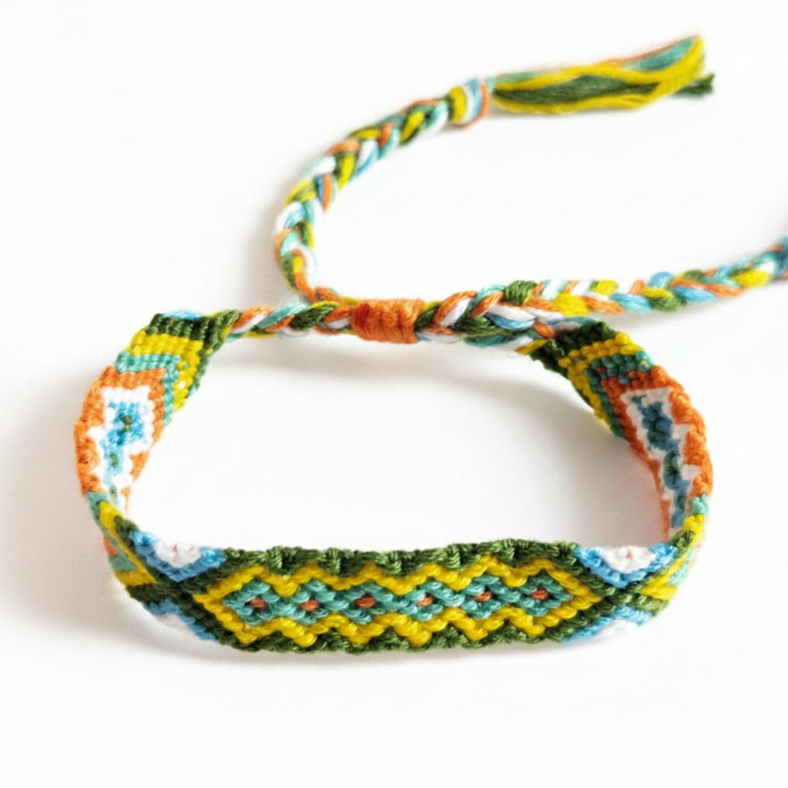 Hand-knotted green, yellow and orange cotton friendship bracelet with diamond pattern – product view