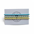 Blue, yellow and white hand-knotted cotton friendship bracelet set of 3 on Mint Sorbet packaging card