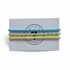 Blue, yellow and white hand-knotted cotton friendship bracelet set of 3 on Mint Sorbet packaging card