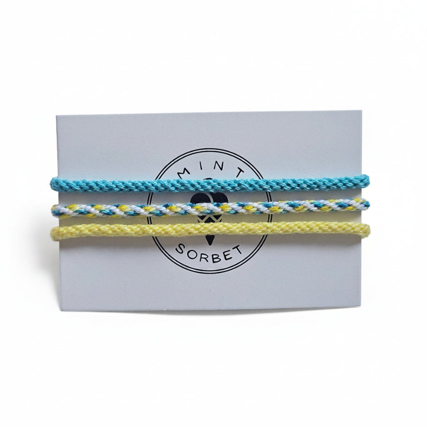 Blue, yellow and white hand-knotted cotton friendship bracelet set of 3 on Mint Sorbet packaging card