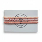 Peach, coral and white hand-knotted cotton friendship bracelet set of 3 on Mint Sorbet packaging card