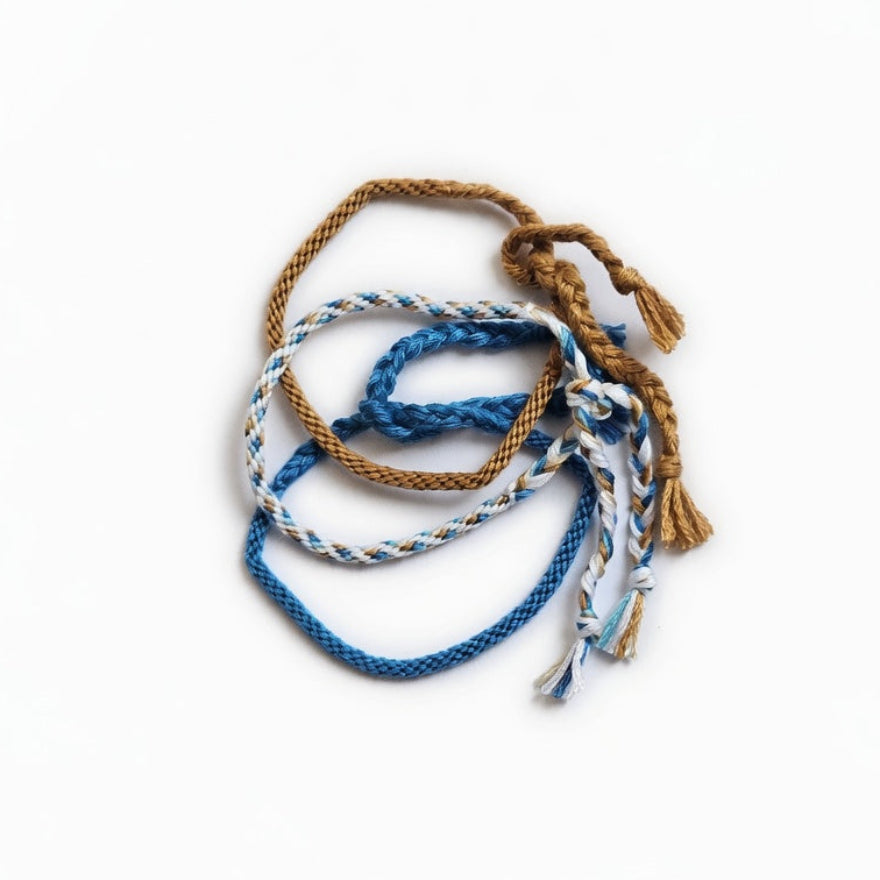 Blue, white and brown hand-knotted cotton friendship bracelet set of 3 – product view