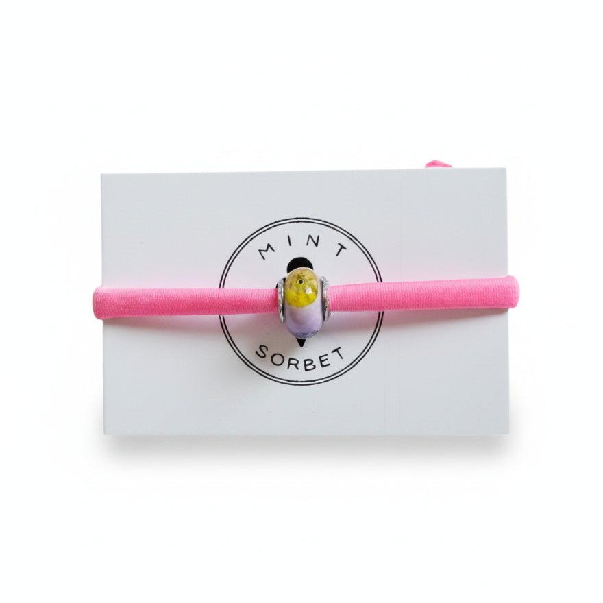 Pink elastic bracelet with multicolor Murano glass bead on Mint Sorbet packaging card