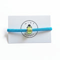 Turquoise elastic bracelet with lime green Murano glass bead on Mint Sorbet packaging card
