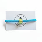 Turquoise elastic bracelet with lime green Murano glass bead on Mint Sorbet packaging card