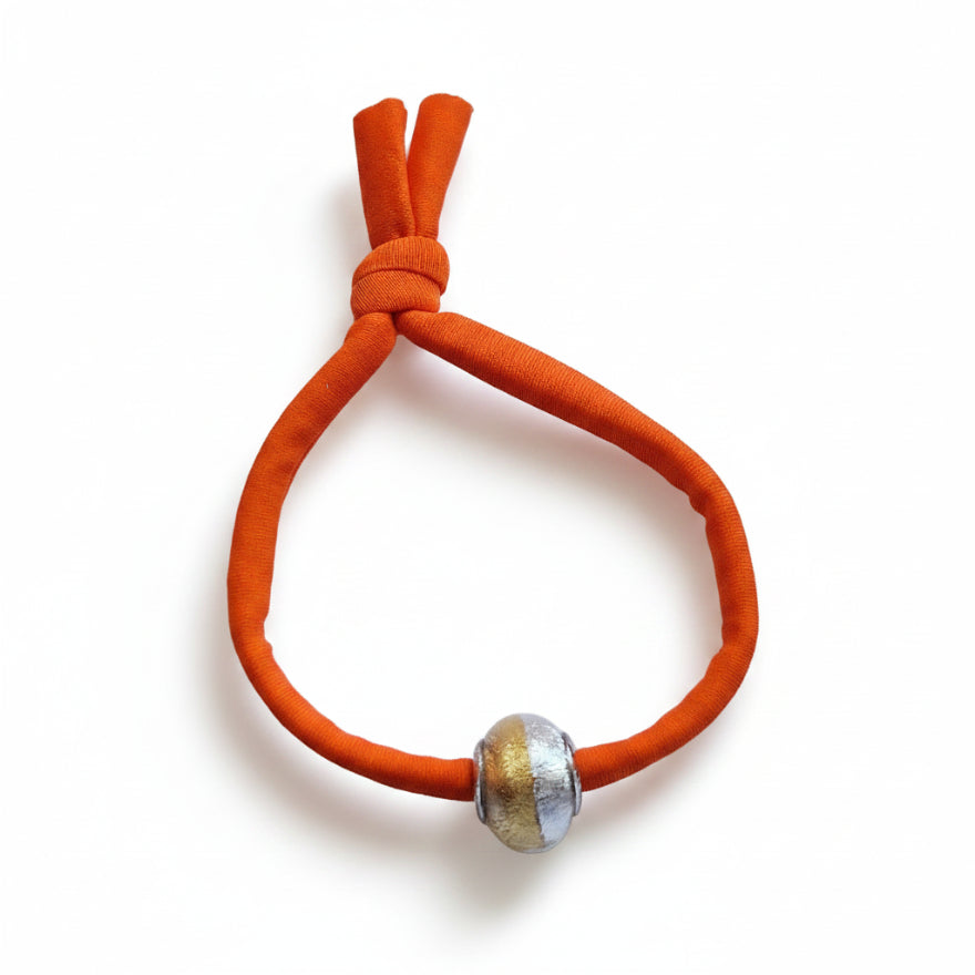 Orange elastic bracelet with gold and silver Murano glass bead – product view