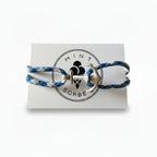 Blue and white patterned nautical rope bracelet with silver stainless steel anchor clasp on Mint Sorbet packaging card