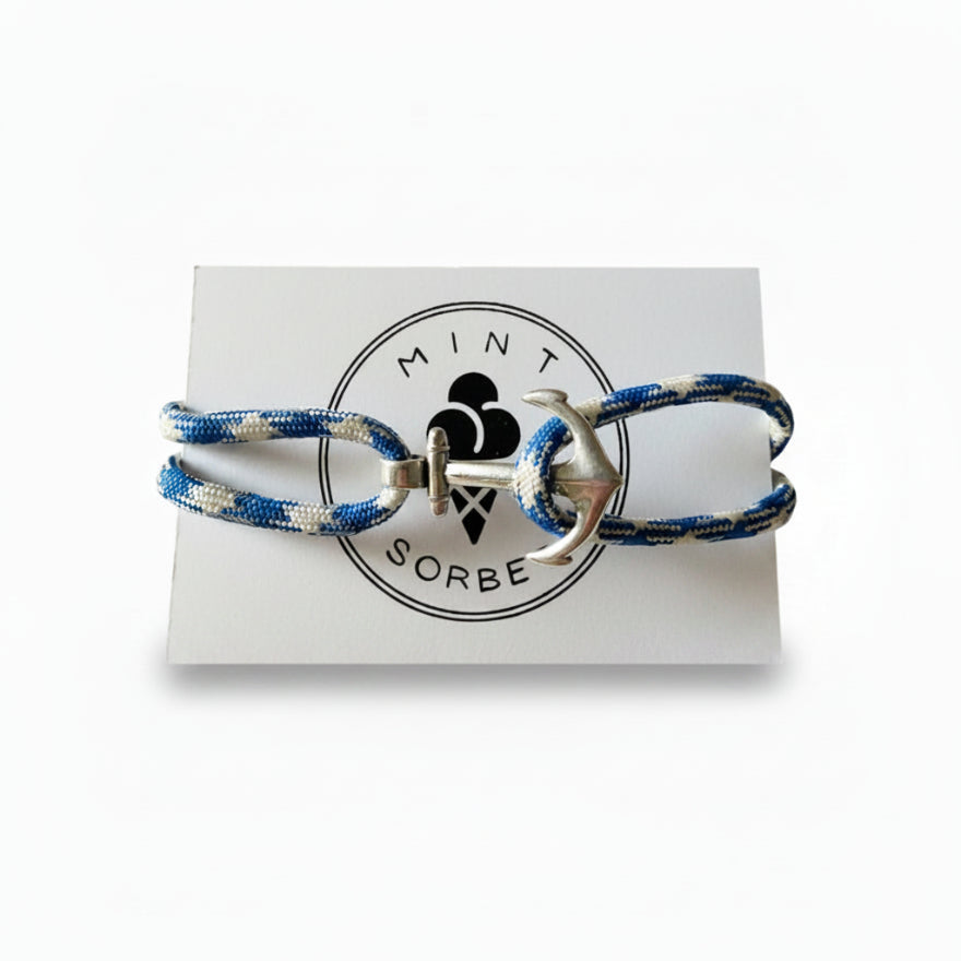 Blue and white patterned nautical rope bracelet with silver stainless steel anchor clasp on Mint Sorbet packaging card