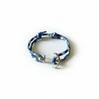Blue and white patterned nautical rope bracelet with silver stainless steel anchor clasp – product view