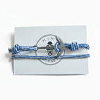 Blue and white striped nautical rope bracelet with silver stainless steel anchor clasp on Mint Sorbet packaging card