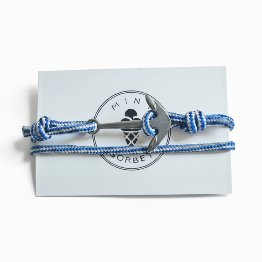 Blue and white striped nautical rope bracelet with silver stainless steel anchor clasp on Mint Sorbet packaging card