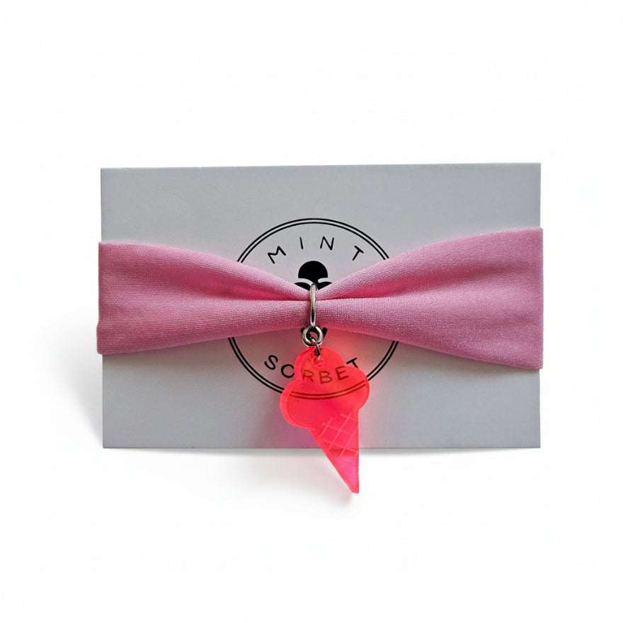 Pink nylon elastic bracelet with neon pink acrylic ice cream cone pendant on Mint Sorbet packaging card