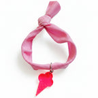 Pink nylon elastic bracelet with neon pink acrylic ice cream cone pendant – product view