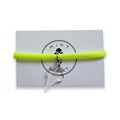 Neon yellow nylon elastic bracelet with transparent acrylic ice cream cone pendant on Mint Sorbet packaging card