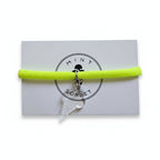 Neon yellow nylon elastic bracelet with transparent acrylic ice cream cone pendant on Mint Sorbet packaging card