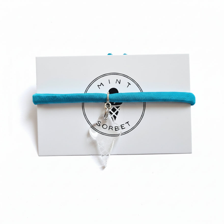 Turquoise nylon elastic bracelet with transparent acrylic ice cream cone pendant on Mint Sorbet packaging card