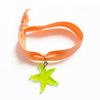 Peach nylon elastic bracelet with neon green acrylic starfish pendant – product view