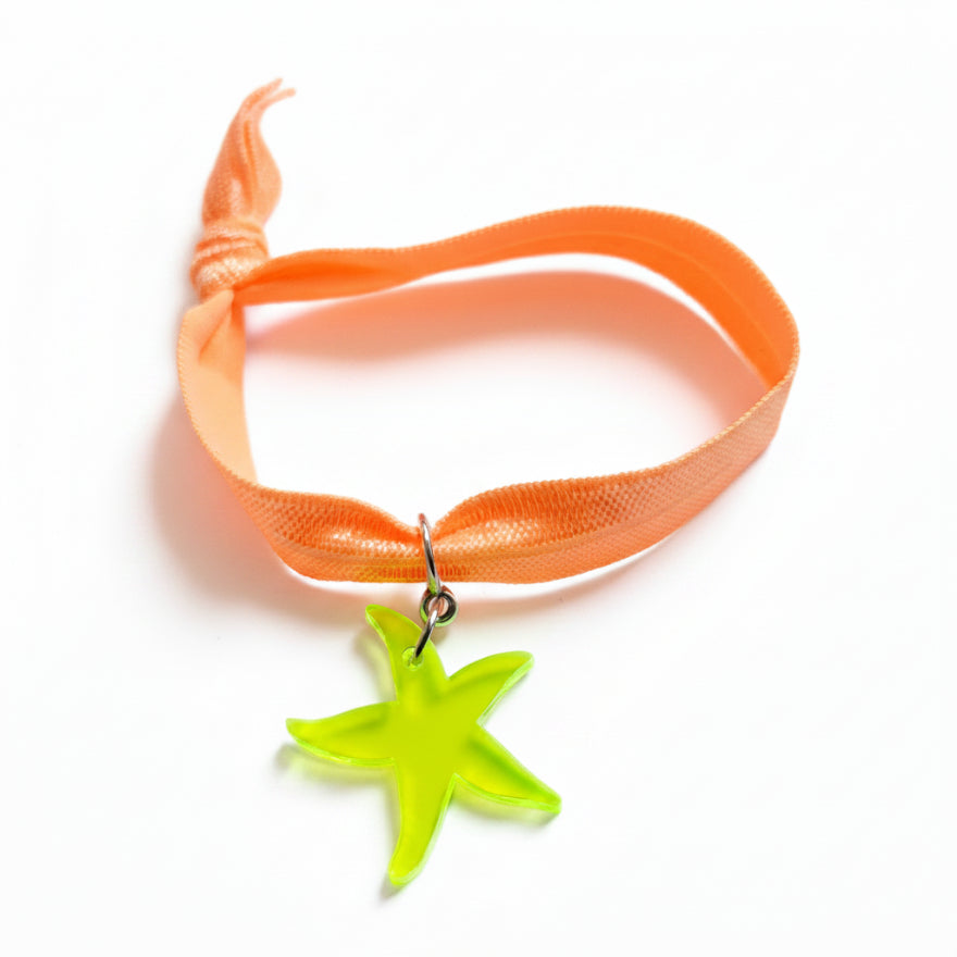 Peach nylon elastic bracelet with neon green acrylic starfish pendant – product view