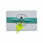 Turquoise nylon elastic bracelet with neon yellow acrylic ice cream cone pendant on Mint Sorbet packaging card