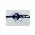 Dark blue paracord bracelet with blue acrylic anchor pendant on Mint Sorbet packaging card