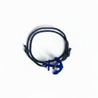 Dark blue paracord bracelet with blue acrylic anchor pendant – product view