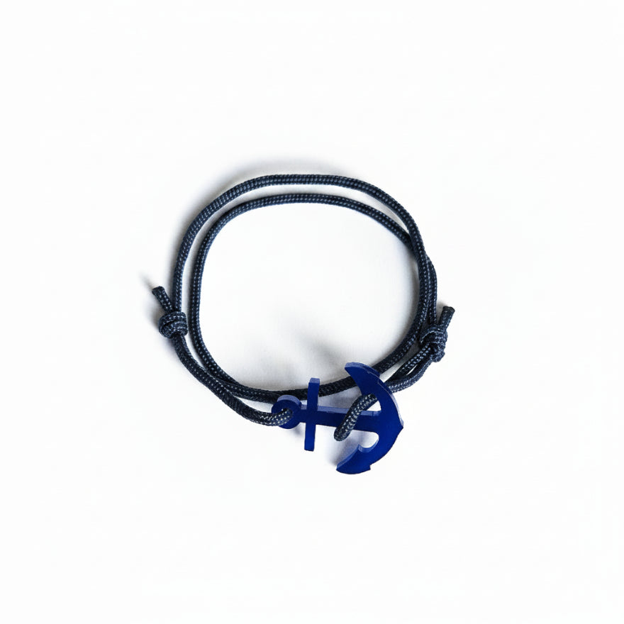 Dark blue paracord bracelet with blue acrylic anchor pendant – product view
