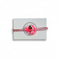 Pink paracord bracelet with neon pink acrylic anchor pendant on Mint Sorbet packaging card