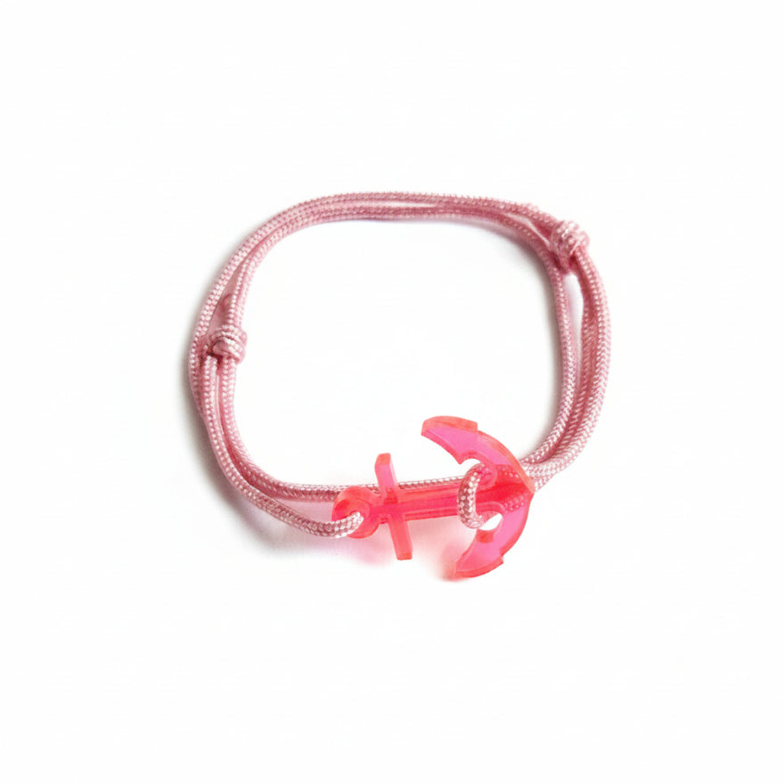 Pink paracord bracelet with neon pink acrylic anchor pendant – product view