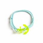 Light blue paracord bracelet with neon yellow acrylic anchor pendant – product view