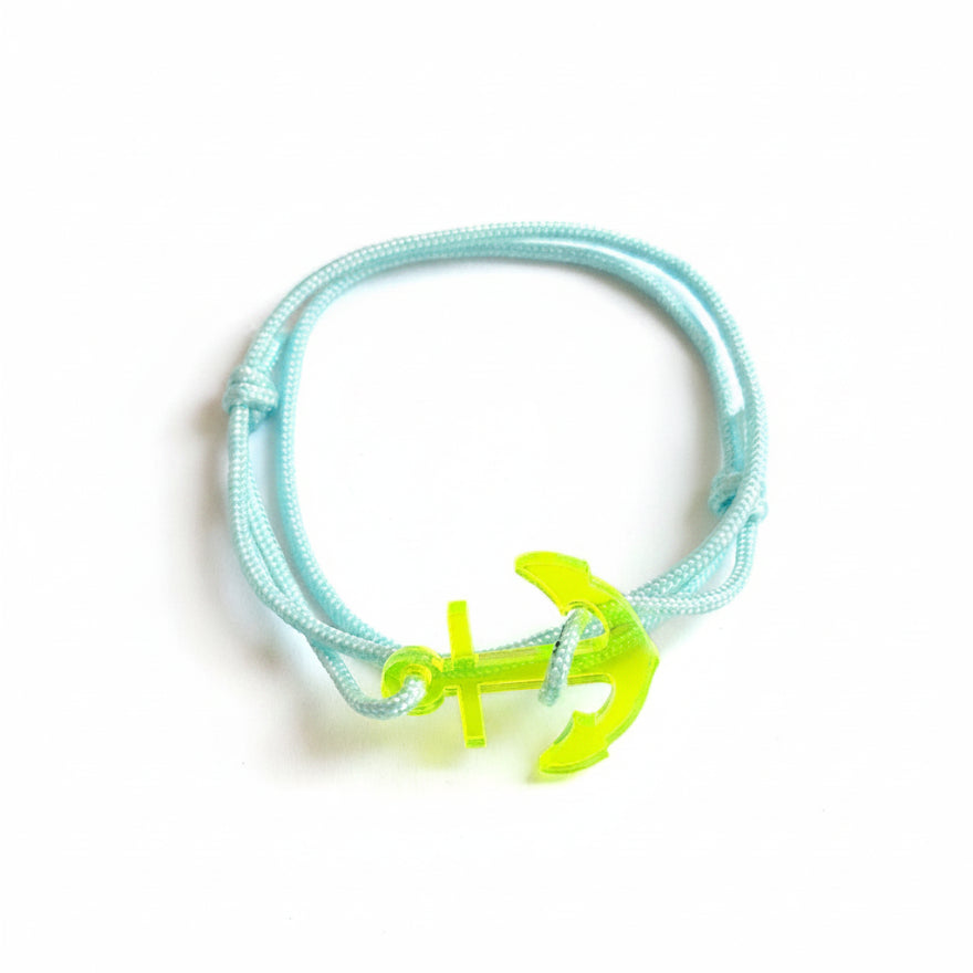 Light blue paracord bracelet with neon yellow acrylic anchor pendant – product view