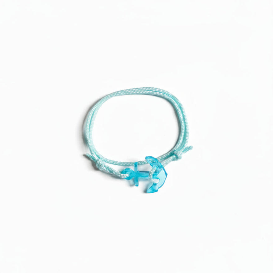 Light blue paracord bracelet with transparent blue acrylic anchor pendant – product view