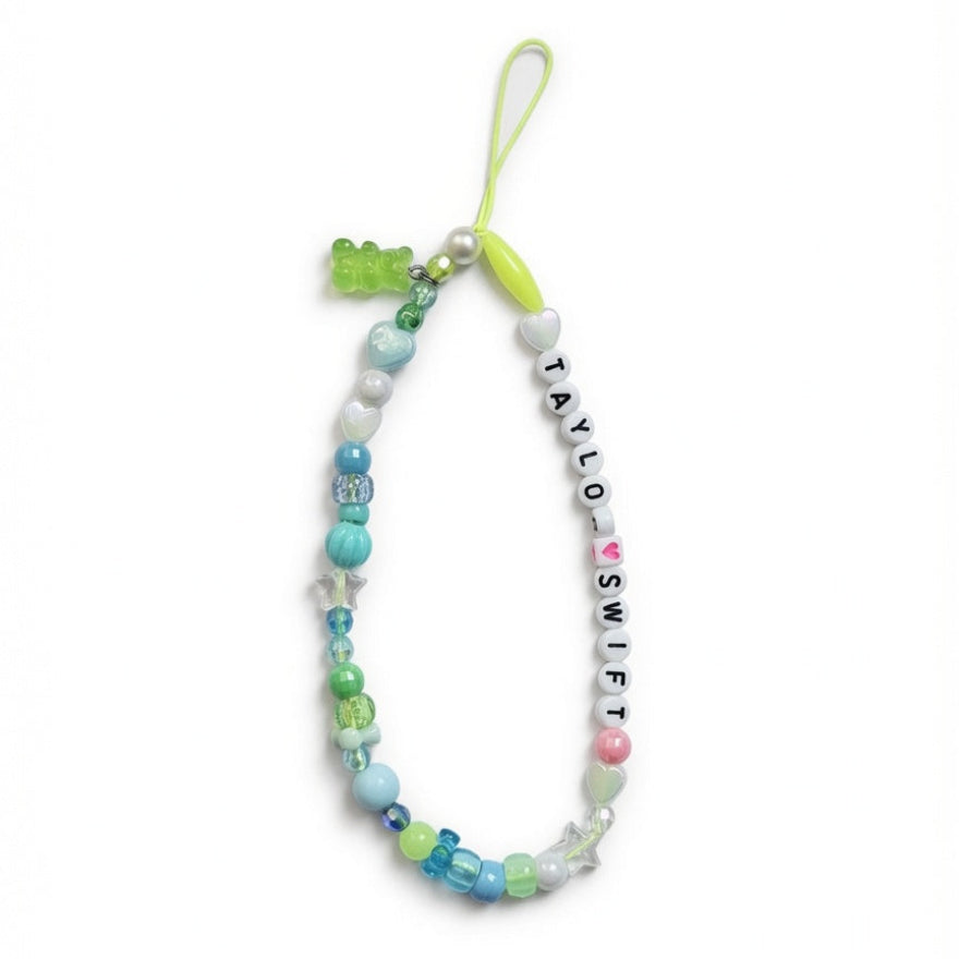 Colorful beaded "Taylor Swift" phone charm with green gummy bear charm – product view