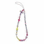 Colorful beaded "Taylor Swift" phone charm with green gummy bear charm – product view
